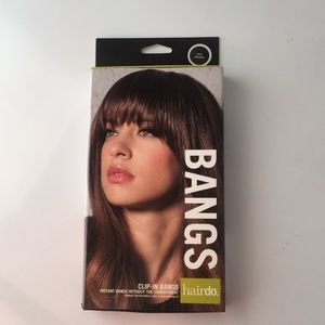 Bangs Hairdo color is chestnut.